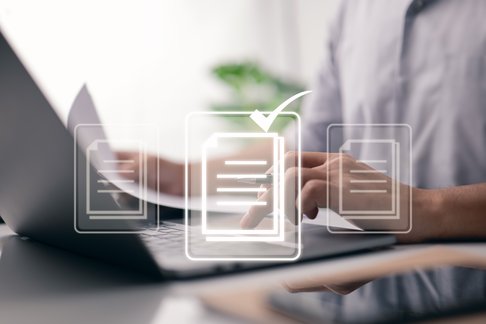 for-online-approve-paperless-quality-assurance-and-erp-management-idea-hand-employing-laptop-computer-with-virtual-screen-and-document (1)